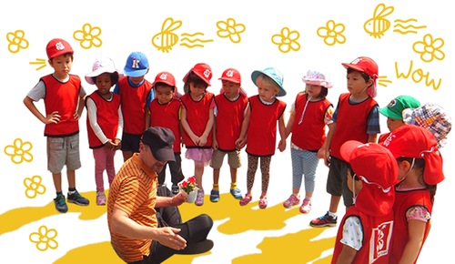 Children learning through outside activities as part of Ohana International School curriculum