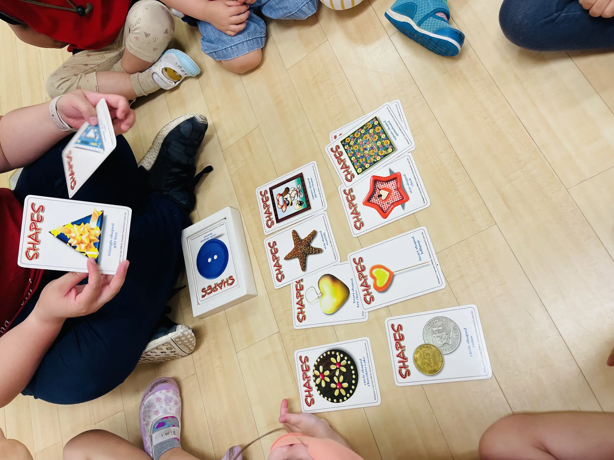 Us, preparing for our “Flashlight” Olympics and reviewing all the different shapes