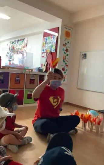 Sayaka explaining to us what the Olympic Flame is