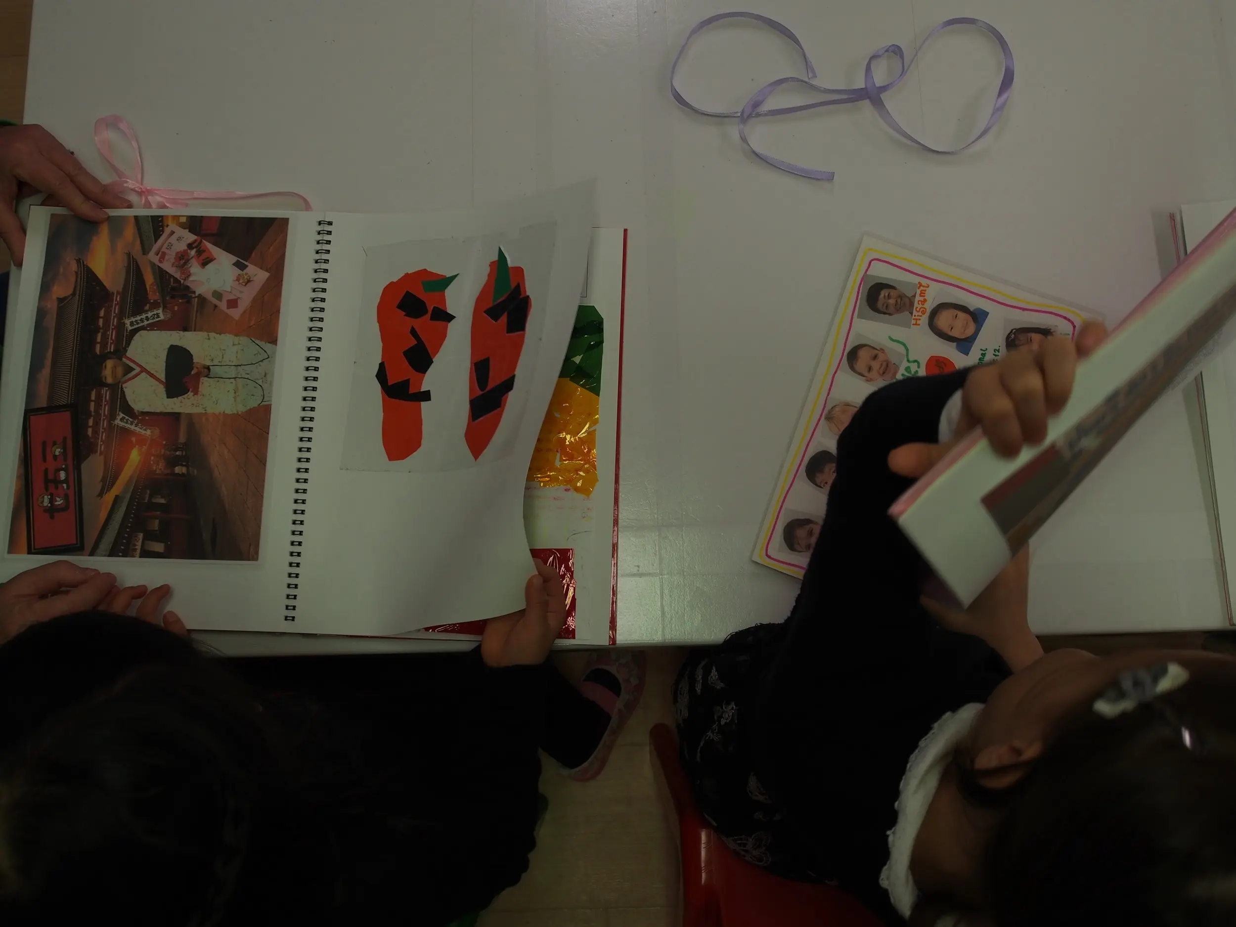 Our friends browse through their portfolios that they got for the farewell party.